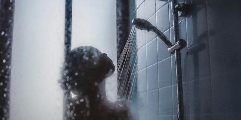 A woman showering.